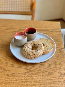 Drivu Tulua Multigrain bagel with labneh and blueberry homemade jam. Yummy