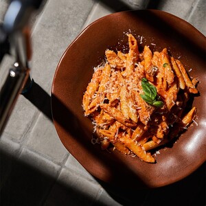 Drivu Homemade three-cheese ravioli in creamy pesto with parmesan, basil, and roasted pine nuts | N,D,G