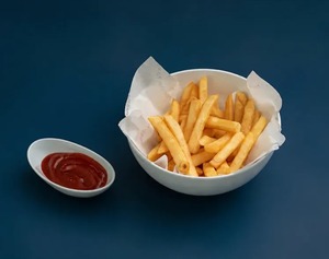 Crispy golden French fries served with ketchup for dipping - Wave Cafe abu-dhabi