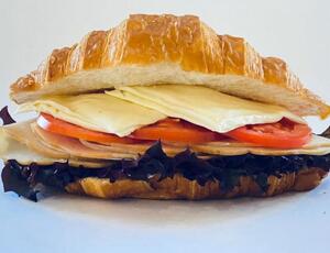 Turkey & Cheese Croissant - Typing Coffee Shop al-ain