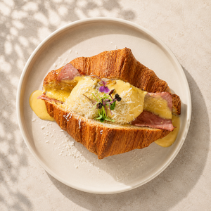 Croissant Eggs Benedict - ZOI Cafe AlJimi al-ain