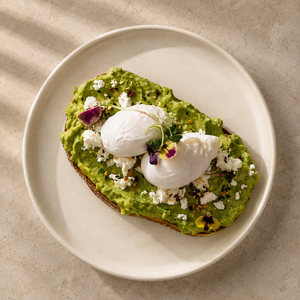 Avocado & Feta Toast with Poached Eggs - ZOI Cafe AlJimi al-ain